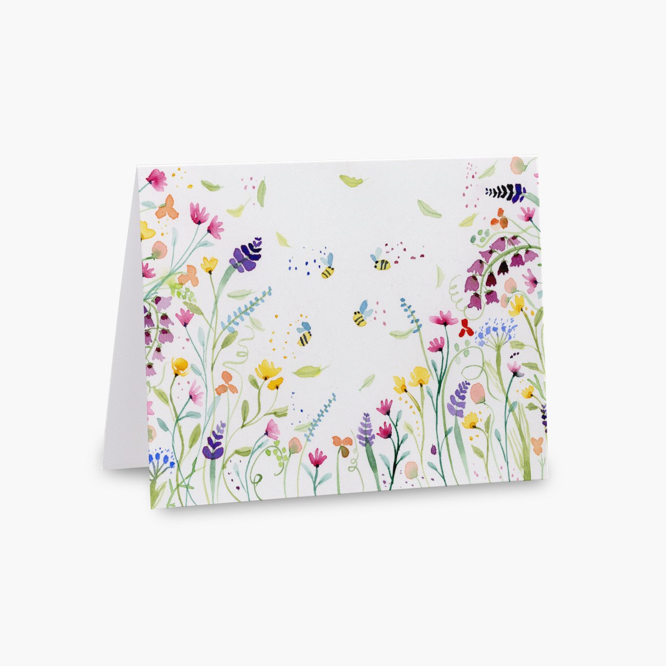 Watercolor notecard of a colorful wildflower meadow in purple, pink, and yellow with little bees flying in the center