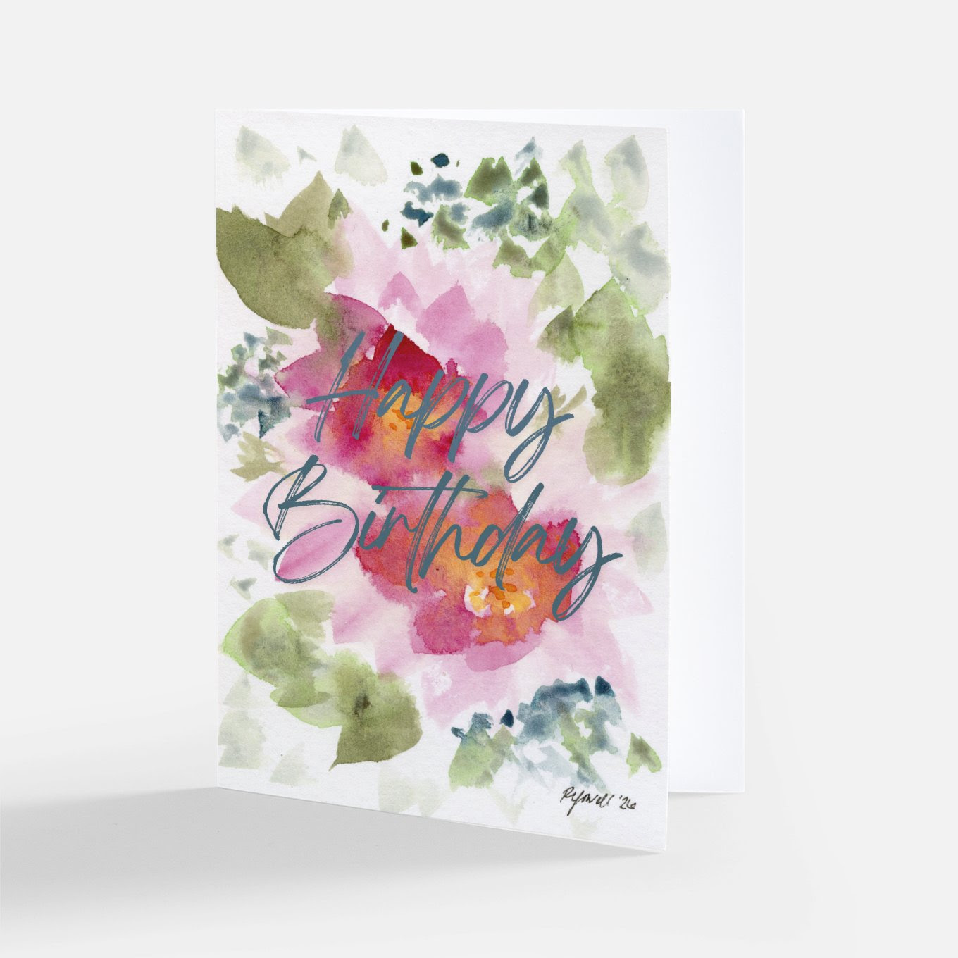 Watercolor birthday card with blue "Happy Birthday" script over a pink water lily surrounded by green leaves